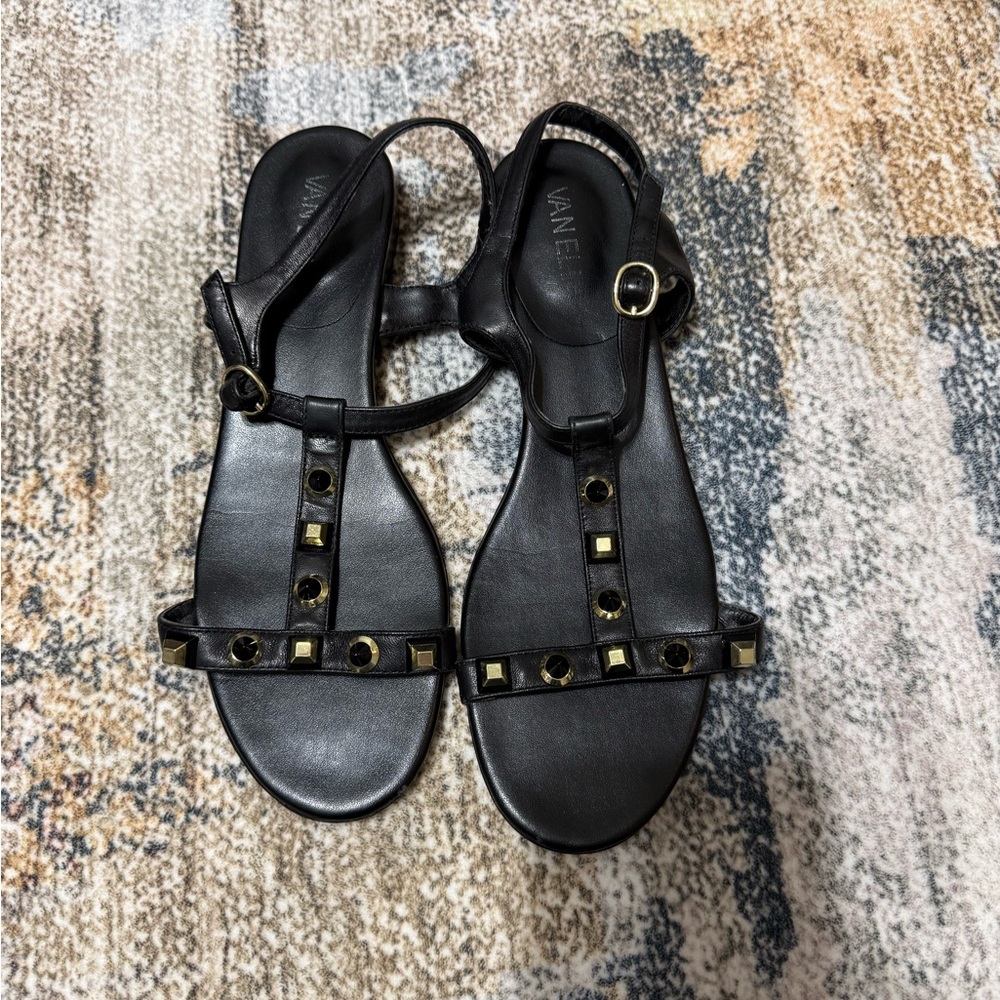Vaneli Black Leather T-Strap Sandals with Gold Studs